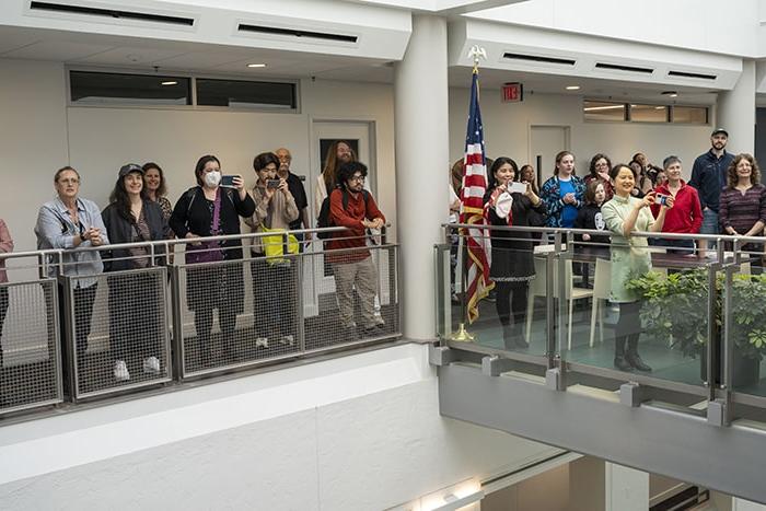 Attendees gather for the unveiling of In the Footsteps of a Stranger